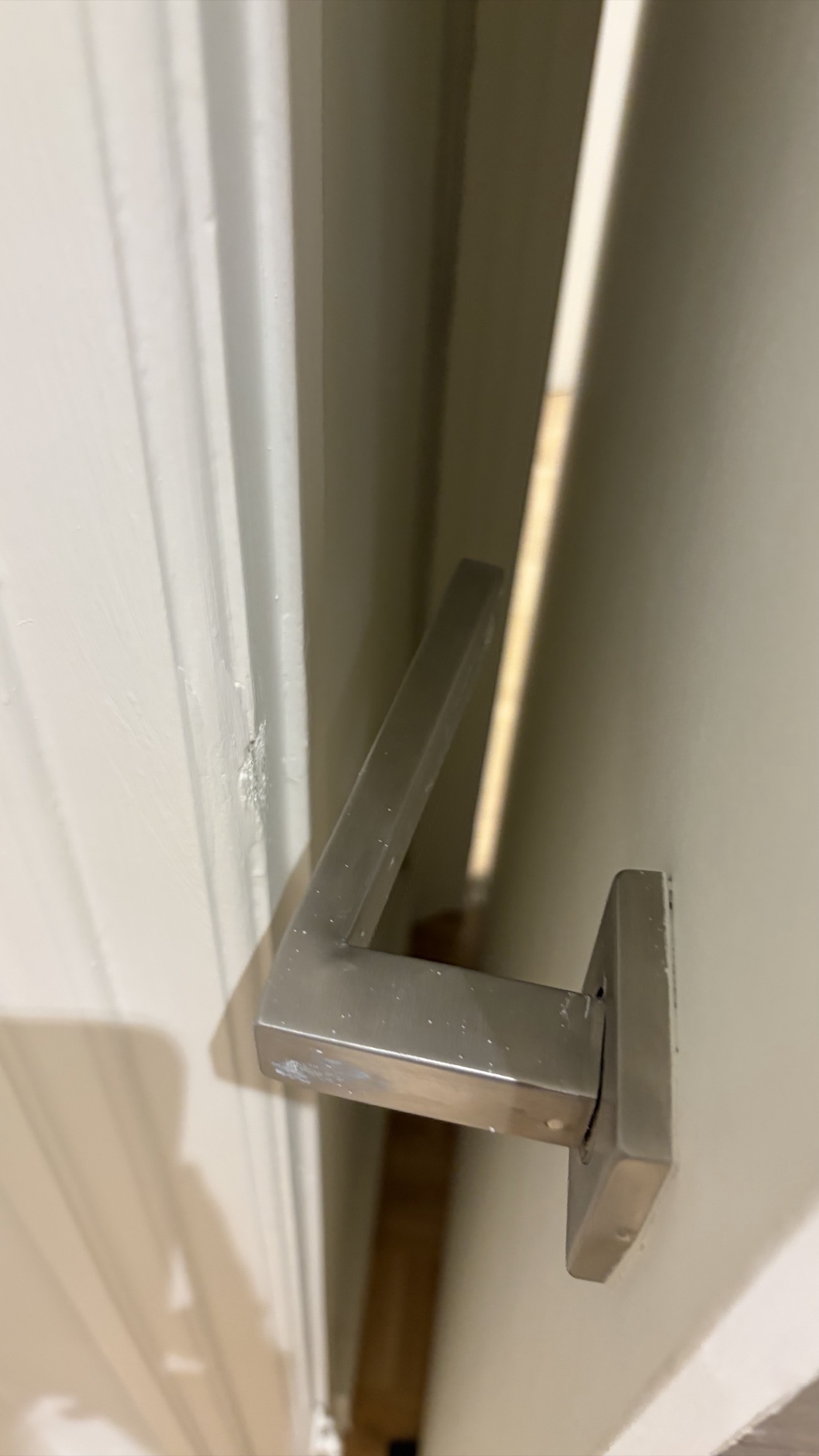 Bent door handle left by previous tenants