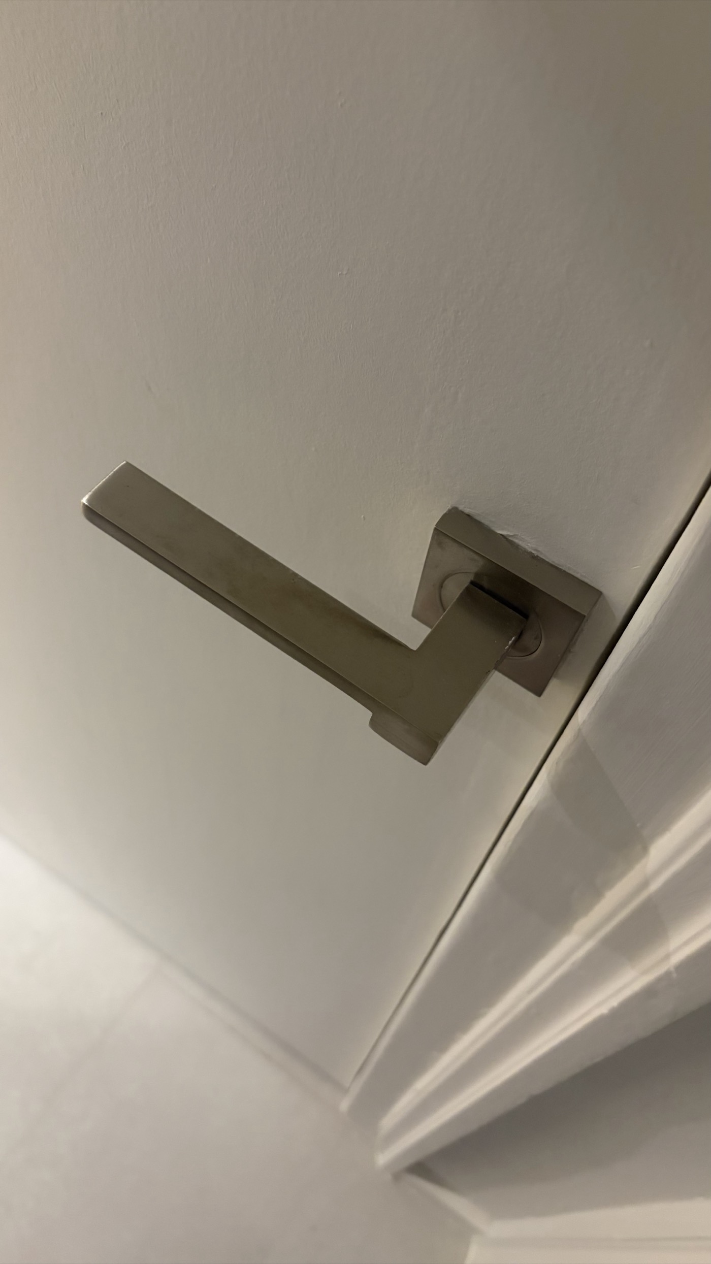 Handle trim plate screwed down flat and secure
